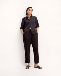 About This Style. This piece features an elastic high waist with a drawcord, a tapered leg that hits at the ankle, front angled pockets, and is made from 100% Lyocell. Pull On Pants, Capsule Wardrobe, Black Pants, High Waist, High Waisted, Elastic, Wardrobe, Pants, Black