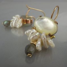 Bridal Pearl Earrings, Shell Pearl Labradrite Large Bee Earrings, Unique Pearl Earrings, Bezel Set, Wedding Jewelry, Feminine EarringsUnique and glamorous bee earrings feature oval large shell set in copper bezel. The bee wings are made of saltwater pearls. Delicate natural labradorite gemstone dangles down and gives it an elegant look.Perfect for a bride or bridesmaid, these earrings are comfortable enough to wear everyday.The hook is made of gold filled. The earring's hook can be made with ste Briolette Yellow Gold Earrings For Weddings, Yellow Gold Briolette Earrings For Wedding, Handmade Briolette Earrings For Formal Occasions, Unique Pearl Drop Earrings For Wedding, Unique White Pearl Earrings For Wedding, Unique Wedding Pearl Drop Earrings, Fine Jewelry Briolette Earrings For Wedding, Briolette Wedding Earrings Fine Jewelry, Dangle Pearl Earrings With Gemstone For Anniversary