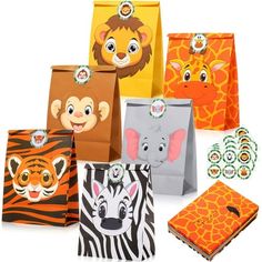 there are many different bags with animals on them and one has an elephant, giraffe, zebra, lion