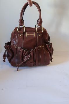 *NWT Womens Sondra Roberts Brown Leather Satchel Handbag COLOR: BROWN BRASS-TONED HARDWARE ZIPPER CLOSURE ONE MAIN COMPARTMENT 1-INTERIOR ZIPPER POCKET 2-INTERIOR SLIP POCKETS 2- EXTERIOR DRAWSTRING SIDE END POCKETS DOUBLE STRAP HANDLE MATERIAL: 100% LEATHER MEASUREMENTS (FLAT): DEPTH: 5" HEIGHT: 11.1" WIDTH: 11.6" HANDLE DROP: 5.5" NWT, NEW WITH TAGS.   (BAG-2) ...clts-trl601-4 Pictures sell! Auctiva offers Free Image Hosting and Editing. The complete eBay Selling Solution. Track Page Views With Auctiva's Counter Drawstring Handbag, Brown Leather Satchel, Leather Satchel Handbags, Ebay Selling, Bag School, Brand Ideas, Backpack School, Satchel Handbag, Satchel Handbags