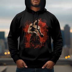 Introducing the Muhammad Ali Hoodie by Ouroboros Art Studio Co., a masterpiece of custom design that embodies the spirit of a champion. This exclusive hoodie elevates your gym wardrobe with its eye-catching graphic, featuring the legendary Muhammad Ali in a dynamic bodybuilder pose, set against a striking red splatter background. This design not only honors the greatness of Ali but also resonates with those passionate about their fitness journey and the muscle fit aesthetic. Crafted with the utm Hooded Graphic Print Sportswear Sweatshirt, Graphic Print Hoodie Sweatshirt For Sportswear, Urban Hooded Hoodie For Sports Events, Hip Hop Sports Hoodie With Graphic Print, Urban Long Sleeve Hoodie For Sports Season, Hooded Sweats With Drawstring Hood For Gym, Sports Hoodie With Graphic Print, Hip Hop Sweatshirt For Gym In Winter, Sports Crew Neck Sweatshirt With Adjustable Hood