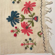 a piece of cloth with flowers and leaves on it