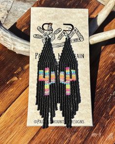 Hand made beaded fringe earrings, with matte black beads and neon serape cacti design in the fringe. Southwestern Black Festival Earrings, Southwestern Style Black Earrings With Colorful Beads, Black Southwestern Dangle Earrings, Southwestern Black Beaded Dangle Earrings, Southwestern Beaded Fringe Earrings, Southwestern Black Beaded Earrings For Festivals, Adjustable Southwestern Black Earrings, Handmade Black Southwestern Beaded Earrings, Handmade Southwestern Black Beaded Earrings