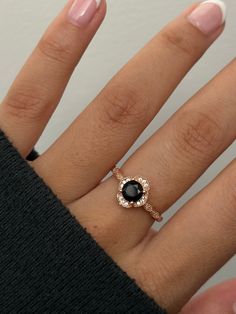 Introducing Ember, an exquisite ring crafted from rose gold-plated sterling silver. Featuring a striking black onyx center stone, this elegant design brings a touch of bold sophistication to any look. A timeless piece for those who love a statement with subtle elegance