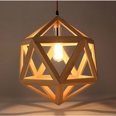 a wooden light fixture hanging from a ceiling