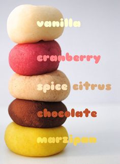 a stack of different colored donuts sitting on top of each other with the words vanilla cranberry spice citrus chocolate