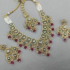 Gold Rodium Polish Red and Maroon color Necklace in Metal Alloy studded with Kundan, Pearl Luxury Ruby Necklace For Festive Season, Luxury Ruby Necklaces For Festive Season, Luxury Red Kundan Necklace For Festivals, Luxury Ruby Kundan Necklace For Festivals, Maroon Necklace, Violet Necklace, Kundan Necklace, Color Necklace, Metal Necklace