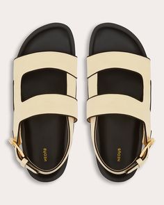 Casually luxe, the Cher sandal features a double-strap design crafted from genuine calf leather and set atop a thick platform sole. Contrast grosgrain piping and shiny goldtone buckles offer elevated appeal. Goldtone buckle closure Contrast grosgrain piping Round toe Upper: 100% calf leather Upper contrast: 100% viscose Lining: 100% goat leather Platform: 100% micro Outsole: 100% TPU Spot clean Handmade in Italy Size & Fit Platform height: 1.96in (50mm) Sustainability Metrics: Circular Economy: Leather Platform Sandals, Circular Economy, Goat Leather, Strap Design, Platform Sandals, Design Crafts, Calf Leather, Leather Upper, Gold Tones