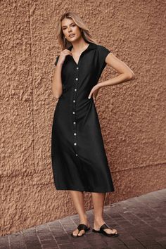 The Black Collared Front Button Midi Dress features a sleek collar and a streamlined midi length for a look that's effortlessly sophisticated. Product code: CAA05B4F004AA Features:  Woven Collared neckline Cap sleeves Front buttons  Maxi Wash Method: Regular Wash Material: 70%RAYON,30%POLYESTER. Solid Color Button-up Dress For Office, V-neck Shirt Dress With Buttons, Classic V-neck Midi Dress With Buttons, Solid V-neck Midi Dress With Button Closure, Sleek Short Sleeve Midi Dress For Summer, Sleek Midi Dress For Date Night, Elegant Short Sleeve Midi Dress With Button Closure, Semi-formal Black Midi Dress With Buttons, Elegant V-neck Shirt Dress With Button Closure