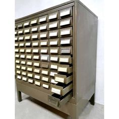 a large metal filing cabinet with many drawers