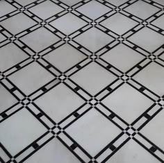 a black and white tiled floor with squares