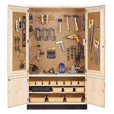 a wooden cabinet filled with lots of tools