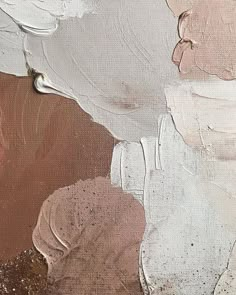 an abstract painting with white, brown and pink colors on the canvass is shown