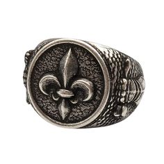 Fleur de Lys signet bronze ring Introducing the Fleur de Lys Knight Ring, an exquisite piece of historical jewelry that embodies the essence of medieval chivalry and heraldry. This men's signet ring is perfect for those who appreciate the timeless elegance of knight jewelry and the rich symbolism of the Fleur de Lys.Design: The ring features the iconic Fleur de Lys, a symbol of nobility and purity, prominently displayed as a coat of arms. Material: Crafted with meticulous attention to detail, th Medieval Engraved Signet Ring Gift, Medieval Engraved Signet Ring For Gift, Antique Silver Signet Ring In Brass, Antique Engraved Silver Signet Ring, Antique Engraved Signet Ring In Silver, Vintage Engraved Metal Signet Ring, Vintage Silver Signet Ring With Antique Finish, Bronze Engraved Medieval Jewelry, Vintage Engraved Antique Silver Signet Ring