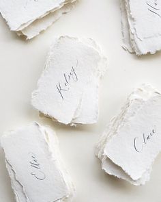 four pieces of paper with writing on them