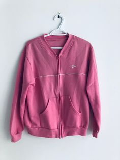 pink vintage nike sweatshirt.  Size:  pit to pit: 22" neck to bottom: 25" collar to cuff: 29" Sporty Pink Sweats For Spring, Casual Pink Sweater With Ribbed Cuffs, Sporty Pink Sweater For Fall, Pink Sporty Sweater For Fall, Pink Cotton Athleisure Sweats, Spring Sports Sweater With Ribbed Cuffs, Pink Cotton Sweats Sportswear, Pink Relaxed Fit Sportswear Sweatshirt, Pink Long Sleeve Sweatshirt With Ribbed Cuffs