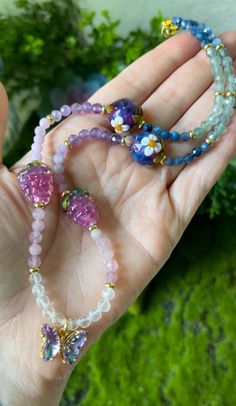 This stunning Choker features Blue Kyanite, Apatite, Amethyst, Mauve Lepidolite, Madagascar Rose Quartz, Clear Quartz, Lampwork glass Berry beads, Gold filled Brass spacers + a Gold filled color shifting glass Butterfly charm. Choker is 17.25 inches. Created + packed with love + intention! 💫 Necklaces come with shipping insurance to ensure they arrive safely! 💕 Glass Crystal Necklaces With Round Beads For Gifts, Crystal Necklace With Czech Glass Faceted Beads Gift, Czech Glass Faceted Crystal Necklaces For Gifts, Gift Crystal Necklaces With Faceted Czech Glass Beads, Gift Crystal Necklace With Czech Glass Faceted Beads, Czech Glass Crystal Necklace With Faceted Beads Gift, Multicolor Amethyst Beaded Necklaces As Gifts, Faceted Czech Glass Beaded Necklaces As Gift, Dainty Chain Necklace