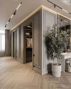 an elegant dressing room with white walls and wood flooring