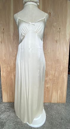 Vintage Silk Long Slip #248 in ivory This item has been made fro 100% sandwashed 19mm silk charmeuse with a rayon trim and silk adjustable straps. size: small/medium will fit bust size 32-34-36 length: 50" HPS to hem sweep of hem 48" hand wash or dry clean recommended Pairs nicely with The Angelique Embroidered Robe #262 or the Long Embroidered Tea Dress, as a slip or can be worn on it's own as nightwear Vintage White Rose by Katherine Harestad This is a one of a kind numbered piece designed by Embroidered Robe, Beautiful Nightgown, Embroidered Robes, Long Slip, Silk Slip, Silk Charmeuse, Tea Dress, Dress Vintage, Vintage Silk