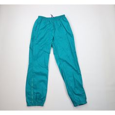 Vintage 90s Columbia Mens Medium Spell Out Cuffed Nylon Joggers Pants Teal Blue Mens Pants Blemishes middle of both legs, front/back. Blemish left bottom Mens size Medium Measurements are: 15 inches across the waist laid flat 32 inch inseam 42 inches from top to bottom Multicolor Nylon US Shipping is FREE, Canada is $15 and International is $24 Check out my other items in my store! PR2052 Green 90s Style Streetwear Bottoms, 90s Style Nylon Sports Pants, 90s Style Blue Nylon Bottoms, Retro Blue Pants For Streetwear, 90s Style Stretch Streetwear Pants, 90s Style Blue Sports Bottoms, 90s Style Sports Pants With Pockets, Blue Full-length Parachute Pants For Streetwear, 90s Blue Parachute Pants For Streetwear