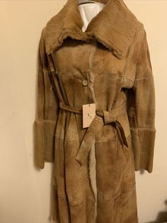 NWT Women’s Salco Genuine Shearling Coat Italy Tan Color Long With Belt Size44/8. Condition is "New with tags". Shipped with USPS Priority Mail. Shearling Coat, Tan Color, Belt Size, Priority Mail, Vest Jacket, Fur Coat, Trench Coat, Women Accessories, Italy