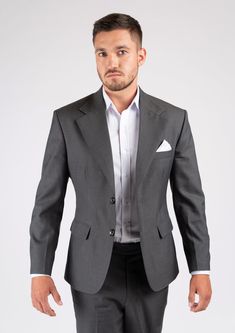 The Ellis Charcoal Suit is crafted from charcoal wool for a sophisticated look that never goes out of style. Perfect for the office, this classic custom suit is tailored to your exact measurements for a comfortable fit that is sure to impress. Classic Gray Tuxedo For Formal Occasions, Formal Gray Blazer With Pressed Crease, Classic Gray Suit With Single Button, Gray Single Button Suit For Office, Gray Single Button Semi-formal Suits, Classic Gray Single Button Suit, Gray Wool Suit For Business Casual, Formal Gray Wool Blazer, Tailored Gray Suit For Formal Occasions