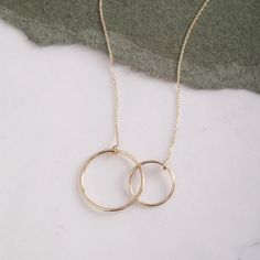 14K or 18K Real Gold Double Chamber Necklace * Solid Gold Nested Ring Necklace * Entwined Circles Necklace * Double Hoop Rings Necklace Real Gold Entwined Circles Necklace for Minimal Design lovers. ✅Gold Material: Real gold, genuine solid gold ✅Gold karat options: 14k or 18k gold) ✅Gold color options: Yellow Gold, Rose Gold, and White Gold 📐DIMENSIONS The big circle's diameter: 1.75 cm The small circle's diameter: 1.2 cm You can customize the necklace chain thickness and necklace length. We ad 14k Gold Hoop Jewelry With Adjustable Chain, 14k Gold Open Circle Jewelry For Anniversary, 14k Gold Circular Jewelry For Anniversary, 14k Gold Hoop Necklaces For Gifts, 14k Gold Filled Hoop Rings, 14k Gold Filled Hoop Rings For Gift, Sterling Silver Hoop Necklace In Yellow Gold, Full Circle Yellow Gold Jewelry As Gift, Yellow Gold Full Circle Jewelry For Wedding