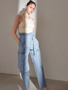 Long 100% cotton trousers. High waisted with ruffle and belt. Model is in MINUSEY ONE SIZE. Please allow 5-12 days shipping when in restocking. * MINUSEY ONE SIZE = EU 34-38, US 2-6* 100% Cotton* Dry clean* Made in Korea - Model Height: 170cm/5'7" (US2, EU34) Cotton Wide Leg Pants With Belt, High Waist Cotton Bottoms With Ruffles, Belted Cotton Trousers, Belted Straight Leg Cotton Bottoms, Belted Straight Cotton Pants, Chic Cotton Parachute Pants With Elastic Waistband, Belted Wide Leg Cotton Bottoms, High Waist Cotton Pants With Ruffles, Cotton Wide Leg Bottoms With Belt Detail