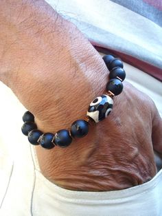 Men's Spiritual Courage, Fortune, Protection Bracelet with Tibetan Eye Fire Agate, Matte Onyx, Hematites - Yoga - Bohemian Man Bracelet by tocijewelry on Etsy Artisan Hand Wrapped Black Bracelets, Artisan Hand Wrapped Black Bracelet, Artisan Hand-wrapped Black Bracelet, Artisan Black Bracelet For Gift, Spiritual Onyx Bracelets With Natural Stones, Black Agate Bohemian Bracelets, Bohemian Onyx Bracelets As Gift, Bohemian Black Agate Bracelets, Spiritual Black Agate Bracelets