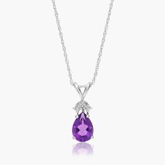 14K White Gold Pear Shaped Amethyst & Tri-Diamond Pendant Necklace. Channel your inner royal in this luxurious pendant necklace. Featuring a beautiful pear shaped gemstone with three diamonds at its top, this expertly crafted necklace exudes elegance. Pair it with the matching earrings for the ultimate shine. Dragon Goddess, Crystal Jewelry Necklaces, Crystals Jewelry, Swarovski Crystal Jewelry, I Love Jewelry, Diamond Pendant Necklace, Fine Jewellery Necklace, Necklace Earring Set, Diamond Pendant