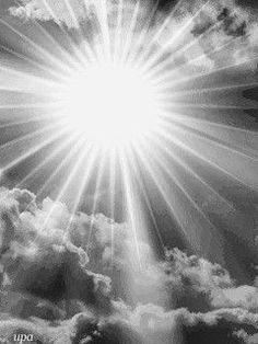 the sun shining through clouds in black and white