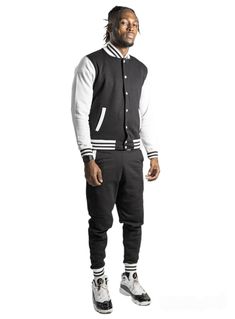 black and white mens varsity sweatsuit set mens hoodie mens joggers mens tracksuit  Unisex varsity jacket jogger set is a great gift for her or gift for him sweatsuit.  Comes with a varsity jacket style button up and joggers  This set is made from thick warm strong durable but soft cotton  Fits true to usa sizes Shipping  Free 1-3 day shipping item usually ships out in 1 business day  I also ship out items on Saturday's when possible 1 day shipping is available for a fee Urban Style Track Jacket With Baseball Collar For Sports, Urban Track Jacket With Baseball Collar For Sports, Fall Sports Track Jacket In College Style, Fall College Style Track Jacket For Sports, Urban Style Varsity Jacket With Baseball Collar For Sports, Urban Varsity Jacket With Baseball Collar For Sports, Urban Cotton Varsity Jacket For Sports, Sporty Varsity Jacket For Fall Sports Events, Sporty Long Sleeve Varsity Jacket For Streetwear