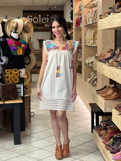 This Adorable Babydoll Dress is the perfect addition to your wardrobe. It's made out of fresh cotton or manta (as its called in Spanish) and it is hand embroidered with cotton string. The design is unique with lace details throughout and the colorful embroidery reflects the Rich Mexican culture! Note: Shoes and Jewelry modeled may be purchased here: Shoes: https://www.etsy.com/es/listing/828873953/zapato-artesanal-de-plataforma-zapato?ref=listings_manager_grid Filigrana Earrings: https://www.ets Beach Cotton Dress With Multicolor Embroidery, Summer Cotton Dresses With Multicolor Embroidery, Summer Cotton Dress With Multicolor Embroidery, Beach Dress With Multicolor Embroidery In Cotton, Folk Style Cotton Dress With Embroidered Hem, Beach Dress With Multicolor Embroidery, Short Sleeve Cotton Dress With Multicolor Embroidery, Multicolor Cotton Embroidered Dress With Embroidered Hem, White Sleeveless Cotton Embroidered Dress