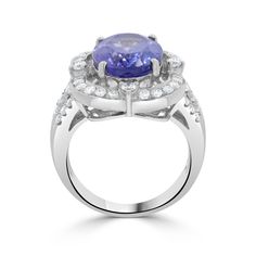 13x10 Violetish Blue AAAA Tanzanite Ring Oval shape 6.40 ct with 0.85 cttw Diamond in 14K White Gold. Product Information SKU TT1010/3 Metal Type 14K Metal Color White Gold Ring Style - Primary Stone Gemstone Name Tanzanite Gemstone Species Zoisite No. of Gemstones 1 Gemstone Grades AAAA Gemstone Shape Oval Gemstone Weight 6.40 Gemstone Size 13x10 Origin Tanzania Secondary Stone Gemstone Name Diamond Gemstone Species Diamond No. of Gemstones 46 Gemstone Grades - Gemstone Shape Round Gemstone Wei Gia Certified Oval Tanzanite Diamond Ring, Gia Certified Tanzanite Oval Rings, Oval Tanzanite Ring With Brilliant Cut, Gia Certified Oval Tanzanite Ring, Oval Tanzanite Diamond Ring With Accent Stones, Oval Tanzanite Gemstones In Prong Setting, Tanzanite Ring, Tanzanite Gemstone, Ring Oval