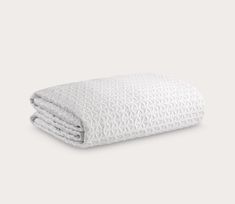 a white blanket folded on top of each other