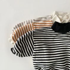 Unveiling Our Exclusive Collection: Cozy Striped High-neck Sweatshirt for Babies! Introducing the perfect blend of warmth and style for your little ones – our Cozy Striped High-neck Sweatshirt crafted with love and precision from soft COTTON material. Designed for ultimate comfort, this unisex delight is tailored for babies aged 9 months to 3 years, ensuring your little fashionista or dapper dude stays snug during the cooler seasons. Key Features: 🌈 Chic Striped Design: Elevate your baby's styl Toddler Tees Boy, High Neck Sweatshirt, Striped Sweatshirt, Spring Kids, Turtleneck Sweatshirt, Striped Sweatshirts, Striped Turtleneck, Girls Stripes, Fleece Sweater