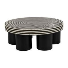 three black and white tables with circular designs