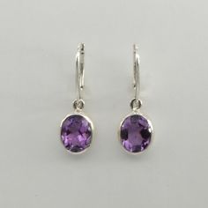 This is a beautiful pair of purple Amethyst Earrings in 925 Sterling Silver. They are made out of Sterling Silver with no nickel so there should be no allergic reaction and nothing will turn green. The silver is not only silver plated or steel but solid 925 Sterling Silver. We usually ship the same day in a nice gift box. Classic Sterling Silver Purple Earrings, Classic Purple Sterling Silver Earrings, Classic Purple Gemstone Earrings, Classic Teardrop Purple Earrings, Classic Purple Drop Earrings, Oval Amethyst Earrings For Gift, Purple Amethyst Earrings, Allergic Reaction, Amethyst Earrings