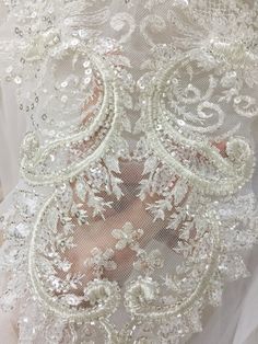 Exquisite 3D silver thread setting heavily beaded lace applique Size is as pictured Price is for one piece more in stock Graceful for wedding gown bodice, bridal dress overlay , bridal veil DIY making . Back to more rhinestone apploique selection https://www.etsy.com/shop/lacetime?ref=hdr_shop_menu&section_id=15471438 my shop link: http://www.etsy.com/shop/lacetime ------------------------------------------------------ ---------------------------------------------------------------- -------- Embellished Lace Wedding Dress For Ceremony, Lace Wedding Dress With Sequins, Wedding Sequin Lace Fabric With Appliques, Lace Tulle Fabric With Appliques For Wedding, Silver Lace Tulle Fabric For Wedding, Beads Wedding Dress, Veils Bridal Diy, Veil Diy, Bridal Hair Decorations