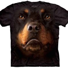 a black and brown dog's face is shown on a t - shirt with an angry look