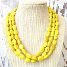 "This simple and stunning triple strand stone necklace is made from yellow oval shaped howlite semi precious stones. A very pretty color of brilliant yellow and golds, with a brown crackle matrix running throughout the stones. I simply strung each strand on a 49 strand nylon coated stainless steel wire and attached a silver filled large lobster claw clasp. The necklace measures 18\" in length and has a 2\" extender chain for a total length of 20\". Please note, the ends of the necklace where the Howlite Jewelry, Bridesmaids Jewelry, Yellow Bridesmaids, Yellow Necklace, Yellow Jewelry, Necklace Chunky, Jewelry Beaded, Yellow Earrings, Turquoise Howlite