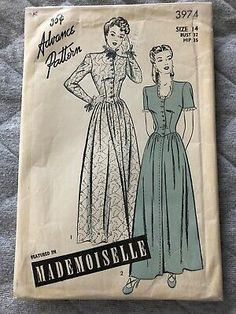 an old sewing pattern from the 1950's, featuring a woman in a dress