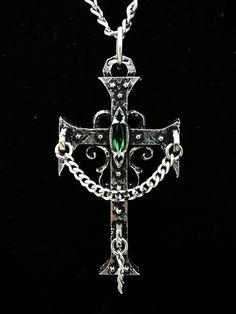 This Gothic Cross necklace is an handmade pewter sculpture orned with a swarovski of your choice. This cross is made thick and solid, the stainless steel chain is very solid, this necklace is alright to wear during Live Action Role Playing games (LARP) or music shows.   This Gothic Cross Pendant is sold with a stainless steel chain This Gothic Cross is a pendant of 7cm  This Gothic Cross Necklace is a pewter sculpture of my own creation, i create and work the metal by myself at home. The material used is the finest and highest grade hypoallergenic pewter alloy of 98%tin You can combine many of my creations in an order to save on shipping charges, it is always same price no matter how many items you order  Wholesale is available for stores, if you are interested please contact me about that Gothic Metal Cross Jewelry, Gothic Cross Metal Jewelry, Gothic Nickel-free Cross Jewelry, Gothic Cross Pendant With Oxidized Finish, Gothic Metal Cross Pendant Jewelry, Gothic Oxidized Cross Pendant Jewelry, Gothic Cross Pendant Jewelry, Silver Gothic Crucifix Jewelry, Collectible Gothic Cross Jewelry