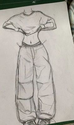 a drawing of a person's shirt and pants on a piece of white paper