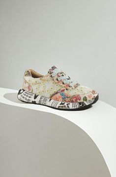 These colorful sneakers take your style to a whole new level with their bohemian floral design, contrasting newsprint outsoles, and sparkly metallic laces. From L`Artiste by Spring Step. Colorful Sneakers, Creative Background, Bohemian Floral, Metal Lace, Sneakers Fashion, Floral Design, Lace, Sneakers, Floral