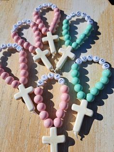 These handmade mini personalized rosaries are a perfect gift for the little loved ones at your special occassion as a keepsake!  Each rosary is made using 8mm coated glass beads and 7mm letter beads, 20x30mm howlite stone cross and nylon thread  Please add name for personalization You can order 1 or scroll down in quantity for discounted bulk orders Pink Cross Rosary Bracelet Gift, Pink Cross-shaped Rosary Bracelet Gift, Personalized Pink Rosary Bracelet For Baptism, Handmade Pink Rosary For Baptism, Mini Rosaries, Personalized Rosary, Stone Cross, Christening Favors, Gift For Students