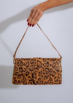 Brown leather handbag with gold hardware and chic, edgy design Trendy Rectangular Shoulder Bag With Animal Design, Trendy Brown Bag With Animal Design, Trendy Rectangular Leopard Print Bags, Leopard Print Shoulder Bag With Animal Design, Trendy Brown Shoulder Bag For Party, Trendy Brown Shoulder Bag With Animal Design, Trendy Brown Clutch For Party, Chic Everyday Leopard Print Shoulder Bag, Trendy Handheld Clutch With Adjustable Strap