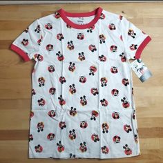 This Womens Disney Mickey Mouse T-Shirt Is Perfect For Any Season And Occasion. With A Solid Pattern And All-Over Logo Print, This Casual Tee Features Short Sleeves And A Crew Neckline With Pullover Closure. Made From A Blend Of Polyester And Cotton, This Machine Washable Shirt Is Easy To Care For And Comes In Size Xs. This Basic Style T-Shirt Is Designed For Juniors And Is An Authentic Disney Product, Manufactured In China. The Classic Mickey Mouse Theme Adds A Touch Of Fun To Your Wardrobe Wit Disney Crew Neck T-shirt For Summer, Mickey Mouse Crew Neck T-shirt For Disney Events, White Mickey Mouse Crew Neck T-shirt, Disney Character Print Cotton T-shirt, White Cotton Disney Shirt, Casual T-shirt For Disney Fan Events In Summer, Cute Mickey Mouse Cotton T-shirt, Cute Minnie Mouse Shirt With Crew Neck, Cute Minnie Mouse Crew Neck Shirt