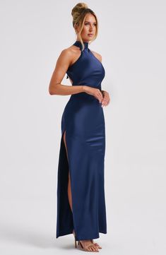 Here's to the nights you will remember because of the fits you won't forget. You will be unforgettable in Etta, our luxe maxi made from bias cut satin that skims beautifully over the body. The dress is completely backless with a high neck and an oversized tie neck detail. Elevate any look with Etta, platform heels and a sleek knot.


Colour: Navy.

Luxury bias cut satin.

High neckline.

Backless detail.

Skims over the figure.

Flares gently at the hem.

Maxi length.

Model is an XS and is wearing an XS.

 Size: XS, S, M, L, XL, XXL Navy Blue Dress Elegant, Guest Ideas, Homecoming Dresses Corset, Be Unforgettable, Long Sleeve Homecoming Dresses, Midi Dress Wedding Guest, Dresses Flowy, Homecoming Dresses Long, The Nights