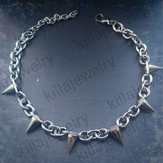 Punk/grunge style chunky spike rivet choker necklace in silver! Unisex. Chain is made from stainless steel.  Spike rivets are made of copper and measure  Available in 3 different sizes: Small ( shown in photographs) Measures 14 inches + 3 inch extension chain  Medium  Measures 16.5 inches + 3 inch extension chain  Large  Measures 19 inches + 3 inch extension chain  Small necklace comes with 6 spikes, Medium with 8 spikes and large with 10 spikes. Please don't hesitate to contact me with any quer Alt Necklace, Spike Choker, Jewelry Grunge, Punk Necklace, Choker Silver, Punk Grunge, Necklace Mens, Small Necklace, Mens Necklace